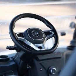 Easy-to-drive steering wheel and dashboard of a Beach Better street-legal golf cart