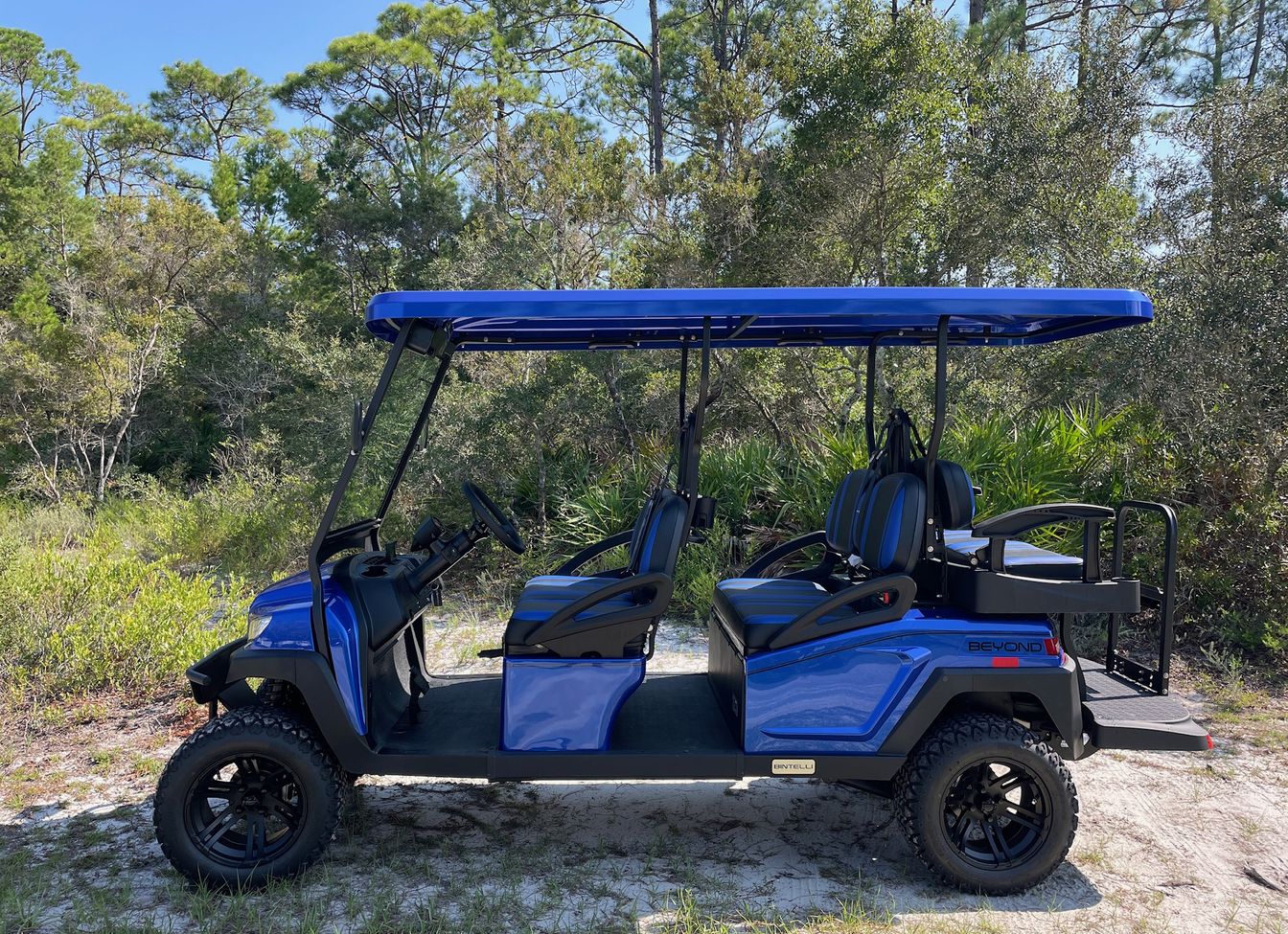 A lifted 6 seat Bintelli Beyond golf cart, shown in blue
